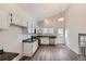 Bright kitchen featuring stainless steel appliances, white cabinets and new wood floors at 2735 S Uravan St, Aurora, CO 80013