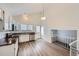 Well-lit kitchen featuring modern stainless steel appliances and sleek white cabinets at 2735 S Uravan St, Aurora, CO 80013