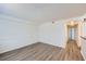 Bright living room features stylish floors and an open layout leading to a hallway at 2735 S Uravan St, Aurora, CO 80013