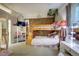A unique bedroom with bunk beds, exposed brick wall and a play and dressing area at 1339 Quince St, Denver, CO 80220