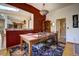 Elegant dining room featuring wood floors, a large window, and decorative light fixture at 1339 Quince St, Denver, CO 80220