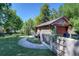 Charming home with brick accents, mature trees and landscaped pathway at 1339 Quince St, Denver, CO 80220