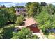 Charming home featuring mature landscaping and a detached two-car garage at 1339 Quince St, Denver, CO 80220