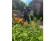 Charming front yard landscape with flowers and lush green plantings at 1339 Quince St, Denver, CO 80220