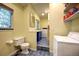 Functional laundry room with washer and dryer, toilet and sink at 1339 Quince St, Denver, CO 80220
