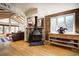 Spacious living room area with hardwood flooring and brick fireplace at 1339 Quince St, Denver, CO 80220