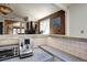 Open concept living area showing a snack bar with decorative wood and painted wall accents, plus an elegant fireplace at 1339 Quince St, Denver, CO 80220