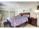 Comfortable main bedroom featuring plush bedding, and closet space at 1339 Quince St, Denver, CO 80220