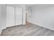 A serene bedroom showcasing contemporary flooring and a spacious closet for ample storage at 17505 E Mansfield Ave # 1412R, Aurora, CO 80013