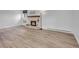 Living room features a fireplace with a white brick surround and hearth, and modern floors at 17505 E Mansfield Ave # 1412R, Aurora, CO 80013