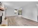 Bright living room with a fireplace, sliding glass door, and modern floors at 17505 E Mansfield Ave # 1412R, Aurora, CO 80013
