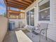 A shaded patio features a concrete floor, and sliding glass doors leading to the indoors at 17505 E Mansfield Ave # 1412R, Aurora, CO 80013