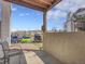 Patio view with parking lot and partial views of the complex and gravel at 17505 E Mansfield Ave # 1412R, Aurora, CO 80013