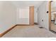 Empty bonus room with carpet, neutral walls, and trim at 911 Lincoln Pl, Boulder, CO 80302