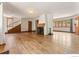 Open living room with hardwood floors, fireplace, and bright windows at 911 Lincoln Pl, Boulder, CO 80302