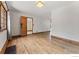 A cozy living room with hardwood floors, a window with curtains, and an open doorway leading to other rooms at 911 Lincoln Pl, Boulder, CO 80302
