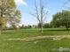 Expansive green open space with trees under a partly cloudy blue sky at 911 Lincoln Pl, Boulder, CO 80302