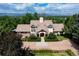 Aerial view of an expansive home showcasing its roofline, private lot, and landscaping at 6483 S Prince St, Littleton, CO 80120