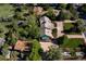 Overhead view of a landscaped home, spacious driveway, and green lawn at 6483 S Prince St, Littleton, CO 80120
