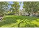 Expansive lawn view of the backyard, showcasing plenty of space for outdoor activities and relaxation at 6483 S Prince St, Littleton, CO 80120