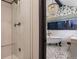Spa-like bathroom featuring white tile shower and freestanding tub with stylish fixtures at 6483 S Prince St, Littleton, CO 80120