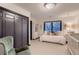 Cozy bedroom with a large window, plush carpet, and a spacious closet at 6483 S Prince St, Littleton, CO 80120