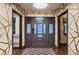 Welcoming entrance with a decorative glass door, hardwood floors, and access to elegantly designed rooms at 6483 S Prince St, Littleton, CO 80120