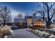 Elegant home with a sprawling driveway and mature landscaping, offering a private and serene setting at 6483 S Prince St, Littleton, CO 80120