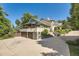 Beautiful exterior elevation featuring a spacious balcony, stone accents, and lush landscaping at 6483 S Prince St, Littleton, CO 80120