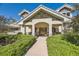 Inviting front entrance with stone accents and well-maintained landscaping, adding curb appeal at 6483 S Prince St, Littleton, CO 80120