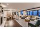 Spacious living room with modern furniture, fireplace, and bright, natural light at 6483 S Prince St, Littleton, CO 80120