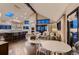 Bright living room with high ceilings, large windows, and seamless flow to the modern kitchen at 6483 S Prince St, Littleton, CO 80120