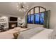 Main bedroom with vaulted ceiling, fireplace, and gorgeous windows at 6483 S Prince St, Littleton, CO 80120