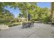 Charming outdoor dining area with patio and lush greenery, perfect for entertaining guests at 6483 S Prince St, Littleton, CO 80120