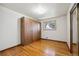 This bedroom features hardwood floors, a window, and a very large closet at 11609 Fowler Dr, Northglenn, CO 80233