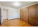 This bedroom features hardwood floors, a window, and a large closet at 11609 Fowler Dr, Northglenn, CO 80233