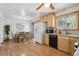 Spacious eat-in kitchen with hardwood floors, plenty of cabinet space, and natural light at 11609 Fowler Dr, Northglenn, CO 80233