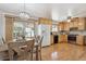 Bright eat-in kitchen with hardwood floors and stainless steel appliances at 11609 Fowler Dr, Northglenn, CO 80233