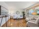 Well-lit living room with hardwood floors, modern decor, and comfortable seating at 11609 Fowler Dr, Northglenn, CO 80233