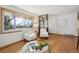 Cozy living room with hardwood floors, large windows, and stylish furnishings at 11609 Fowler Dr, Northglenn, CO 80233