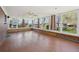 This sunroom features hardwood floors and many windows at 11609 Fowler Dr, Northglenn, CO 80233