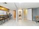 Finished basement with a wet bar and a staircase at 3709 S Fairplay Way, Aurora, CO 80014