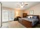 Bedroom featuring a ceiling fan and access to an outdoor patio at 3709 S Fairplay Way, Aurora, CO 80014
