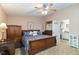 Bedroom with wood furniture and access to the bathroom at 3709 S Fairplay Way, Aurora, CO 80014