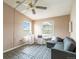 Bedroom featuring a ceiling fan and two windows for natural light at 3709 S Fairplay Way, Aurora, CO 80014