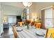 Elegant dining room with a view of the living room and plenty of natural light at 3709 S Fairplay Way, Aurora, CO 80014