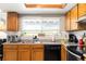 Well-lit kitchen with stainless steel appliances, granite counters, and white tile backsplash at 3709 S Fairplay Way, Aurora, CO 80014
