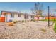 Exterior featuring a patio area, modern landscaping, and a detached garage at 1600 S Dahlia St, Denver, CO 80222