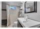 Clean basement bathroom with a walk-in shower at 1600 S Dahlia St, Denver, CO 80222