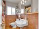 Classic bathroom with unique tile design, traditional fixtures and built-in shelving at 1600 S Dahlia St, Denver, CO 80222